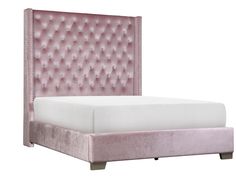 an upholstered bed with pink velvet headboard and foot board in front of a white background