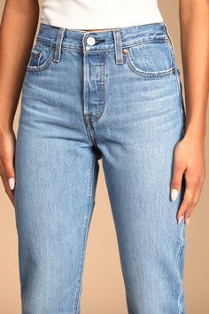 We just can't get enough of the Levi's Wedgie Straight Light Wash Distressed High-Rise Cropped Jeans! Sturdy denim (in Levi's Athens No Way wash) forms these incredibly cute and on-trend jeans with a five-pocket cut, belt loops, and high-waisted fit. Branded top button and hidden button fly top straight pant legs with frayed, cropped hems. Red logo tag and leather patch at back. Fit: This garment fits true to size. Length: Ankle length. Size 26 Waist: Fitted - very fitted at natural waist. Hip: Trend Jeans, Jean Trends, Red Logo, Logo Tag, Straight Leg Denim, Straight Pants, Leather Patches, Cropped Jeans, No Way