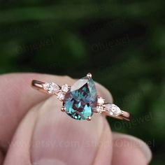 This is a 1.3 carat Lab treated alexandrite engagement ring in solid gold,about 6X8mm pear cut. The accent stones are round 1.5mm and marquise 2x4mm moissanites. It can be made in any ring size. However please contact me to custom make it to a special big or small size. It can be made in white gold,rose gold or yellow Engagement Rings No Diamond, Rings Alexandrite, Christmas Rings, Silver Solitaire Engagement Ring, Alexandrite Rings, Ring For Women Unique, Rose Gold Art, Alexandrite Jewelry, Moissanite Wedding Ring Set