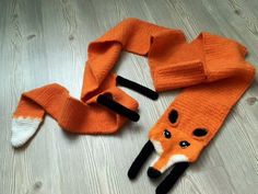 an orange knitted fox hat and scarf