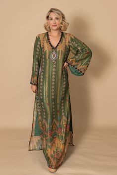 Sparkle and shine in the Palm Royale Kaftan! Made with a sparkling fabric and adorned with sequin embellishments on the neckline, this kaftan is perfect for your next event. Step out in style and make a statement with this stunning piece. Runs small, size up one size unless you are very petite. Traditional V-neck Maxi Dress For Festive Occasions, Elegant Tunic Kaftan For Festivals, Silk Maxi Dress With Sequins, Summer Long Sleeve Sequin Maxi Dress, Bohemian Dress With Zari Work For Eid, Flowy Tunic Kaftan For Party, Festive V-neck Dress For Festivals, Bohemian Maxi Dress With Zari Work For Festive Occasions, Bohemian Floor-length Kurta For Party