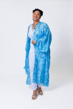 Elevate your summer style with the elegant touch of silver featured in this lightweight kimono. Its versatility makes it ideal for beach days, lunches, or date nights, ensuring you'll make a statement wherever you go this season. Wrap Kaftan For Beach Cover-up In Spring, Spring Open Front Kaftan For Beach, Elegant Summer Kimono With Open Front, Elegant Blue Beach Kimono, Elegant Blue Kimono For Vacation, Blue Beachwear Kimono For Summer, Blue Wrap Kimono For Beachwear, Spring Blue Wrap Kaftan, Elegant Blue Kimono For Summer