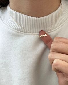 In celebration of all the great mothers around the world, treat the mom in your life to this piece of jewelry they deserve with this gold mama necklace. A perfect way to express what means most to you! Available in 14K yellow, rose or white gold Letters measure about 5mm in height Necklace total length is measured from end to end Dainty minimalist everyday necklace Mother's Day 14k Gold Birthstone Charm Necklace, 14k Yellow Gold Name Necklace For Mom, Everyday Fine Jewelry Necklaces For Mother's Day, Delicate Yellow Gold Necklaces For Mother's Day, Delicate Yellow Gold Necklace For Mother's Day, Minimalist Birthstone Necklaces For Mother's Day, Delicate Yellow Gold Name Necklace For Mother's Day, Everyday 14k Gold Necklace For Mother's Day, Delicate Birthstone Necklaces For Mother's Day