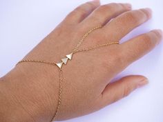 This Original Handlet Jewelry is perfect for bridesmaid, wedding,... This Hand Bracelet is made with Gold plated chain adorned with 3 triangles with Transparent Zirconia inside. ➵ Perfect to wear alone or for layering with more bracelets.➵ The bracelet length is ajustable thanks to 5 cm (2 in) extender chain.➵ Other Handlets: https://www.etsy.com/fr/shop/silverbirdjewels?ref=seller-platform-mcnav&section_id=25004783--*--*--*--*--*--*--*--*--*--*--*--*--*--*--*--*--*--*--∞ SIZE ∞- Bracelet le Dainty Adjustable Jewelry With Jewels, Elegant Rose Gold Body Jewelry For Wedding, Metal Body Jewelry With Adjustable Chain For Weddings, Wedding Body Jewelry With Adjustable Metal Chain, Rose Gold Body Jewelry For Wedding, Delicate Metal Chain Bracelet For Wedding, Dainty Adjustable Chain Body Jewelry For Wedding, Dainty Body Jewelry With Adjustable Chain For Wedding, Adjustable Round Chain Bracelet For Wedding