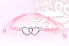 Handmade bracelet with HEART in metal. It is infinitely adjustable in length and can be applied up to a circumference of 22 cm. Nickel-free Silver Friendship Bracelet, Metal Bracelets With Sliding Knot, Adjustable Metal Bracelets For Valentine's Day, Adjustable Metal Bracelet For Valentine's Day, Trendy Silver Heart Bracelet For Friendship, Adjustable Silver Metal Braided Bracelet, Handmade Pink Braided Bracelets As Gifts, Trendy Silver Braided Bracelets For Friendship, Casual Pink Braided Bracelets As Gift