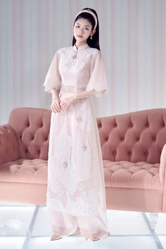 Indulge in the luxurious elegance of our Ao Dai. The delicate organza material flows gracefully, while the A-line cut and flare sleeves add a touch of sophistication. Perfect for any occasion, this piece will surely make a statement. Length: 125cm (+-2cm) Mean Blvd, A Line Cut, Flare Sleeves, Organza Fabric, Lunar New, Flared Sleeves, Designer Collection, Custom Color, Floor Length