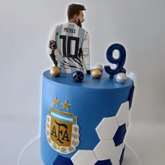 a cake decorated with the number nine and an image of a soccer player on top