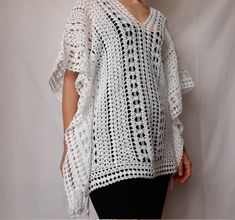 Beach lace tunic, white color, made of mercerized cotton. The pattern gives a nice ethnic look. The width is adjustable, as there are two strings on both sides (Romanian cord made also by hand) of the same thread. It can be worn as a short caftan, a beach dress, or swimsuit cover up. The cotton and the lace pattern give a pleasant cooling effect, helping to enjoy the summer days.  Made in smoke free, pet friendly environment.  Length: 27'' or 68 cm Width: 31'' or 78 cm Neck opening depth: 7.5'' White V-neck Crochet Dress For Beach, White Crochet Bohemian Cover-up, White Crochet Lace Top For Beach Cover-up, White Crochet Beach Cover-up, White Beachwear Tunic For Beach Season, White Crochet Cover-up For Vacation, White Crochet Cover-up For Beach Season, White Poncho For Spring Beach Cover-up, White Beach Cover-up Tunic