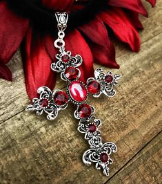 "This is a beautiful mid century cross on a black velvet rope size 14 with extension can go to 17\", antique silver with red rhinestones" Medieval Cross Necklace As Gift, Medieval Cross Necklaces As Gifts, Victorian Cross Necklace, Medieval Cross Necklace For Gift, Red Crucifix Cross Necklace For Gift, Red Cross Necklace, Handmade Red Cross Pendant Jewelry, Elegant Red Cross Pendant Jewelry, Vintage Red Cross Jewelry