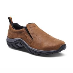 Men's Merrell Jungle Moc - Nubuck Brown - 45° Angle - Available at Tradehome Shoes Rugged Cushioned Slip-on Walking Shoes, Functional Leather Slip-on Walking Shoes, Leather Slip-ons With Moc Toe For Outdoor, Comfortable Outdoor Walking Shoes With Moc Toe, Rugged Slip-on Walking Shoes With Vibram Sole, Outdoor Low-top Walking Shoes With Leather Footbed, Slip-on Sneakers With Vibram Sole For Outdoor, Functional Leather Moc Toe Walking Shoes, Brown Functional Walking Shoes With Arch Support