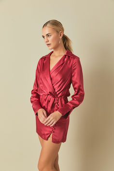 Made with a beautiful satin fabric and unique button details, this satin mini dress is the perfect outfit for a date night, party, birthday celebration, and any other special occasion! Elegant Backless Mini Dress For Going Out, Elegant Mini Dress For Going Out And Party Season, Glamorous Long Sleeve Satin Dress For Night Out, Flirty Satin Mini Dress For Date Night, Sleek Long Sleeve Satin Dress For Date Night, Chic Satin Mini Dress For Date Night, Party Dress With Button Closure, Mini Length, Elegant Mini Dress With Button Closure For Going Out, Elegant Going-out Mini Dress With Button Closure