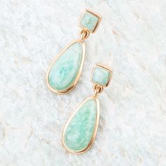 Upgrade your earring game with our Smooth Teardrop Earrings in Amazonite. Made of genuine green Amazonite and bronze, these handcrafted beauties feature a teardrop amazonite stone hanging from a square stone, with a high polish bronze bezel. At just 1.1" and .4" at its widest, these earrings are both lightweight with each earring only weighing .11oz. and stylish! Natural variances are part of the beauty of our genuine stones. Your piece will vary slightly from the image shown. Elegant Amazonite Dangle Jewelry, Amazonite Drop Earrings As Gift, Dangle Earrings With Amazonite And Natural Stones, Amazonite Natural Stone Earrings For Gifts, Elegant Amazonite Earrings As A Gift, Elegant Amazonite Earrings For Gift, Green Amazonite, Lapis Ring, Amazonite Stone