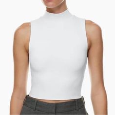 This Is A Mockneck Tank Top With A Body-Hugging Fit. It's Made With Babaton's Signature Contour Luxe, Ultra-Flattering Fabric Coveted For Its Smoothing Effect And Second-Skin Feel. Essential For Every Body. Size M New With Tag Stretch Mock Neck Top For Summer Layering, Summer Stretch Mock Neck Top For Layering, White High Stretch Turtleneck Tops, White Stretch Tops With Funnel Neck, Chic High Neck Tops With High Stretch, White High Neck Casual Top, White Trendy Turtleneck Top, Casual White High Neck Top, Trendy White Turtleneck Top