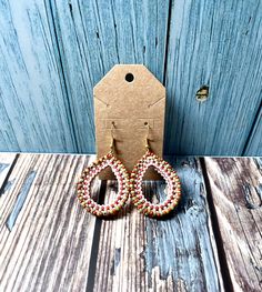 These cute earrings remind me of summer and watermelons. They will dress up any outfit. Handmade Multicolor Earrings For Spring, Orange Earrings For Summer Beach Occasion, Orange Earrings For Summer Beach, Orange Earrings For Summer Beach Outings, Orange Earrings For Beach In Summer, Orange Earrings For Spring Beach Outing, Handmade Pink Hoop Earrings For Summer, Summer Teardrop Beaded Earrings, Pink Bohemian Earrings For Vacation