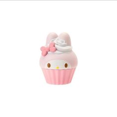 a pink cupcake with a hello kitty face on it's side and a bow around the top