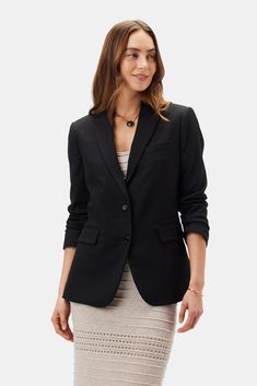 Tobie, a slim-cut, lightweight blazer with tailored suiting details, is an essential foundation piece for a modern working wardrobe. Tailored blazer with notched lapel, welt pockets, and urea buttons Slim fit 67% Recycled Polyester, 26% (FSC) Viscose, 6% Linen 1% Spandex 100% Recycled Polyester lining 27 1/2" in length Runs narrow through the sleeve. Size up for a roomier fit Ethically Made in India Part of a matching set Working Wardrobe, Lightweight Blazer, Foundation Piecing, Tailored Blazer, Linen Blazer, Black Blazers, Welt Pockets, Welt Pocket, Matching Sets