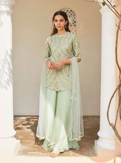 Editor's Note This Set Features Pastel Green Embroidered Silk Kurta, Sharara, And Dupatta Set Color: Pastel Green Fabric: Silk And Tissue Kora Dry Clean Only   About the Designer A melange of r... Sharara Designs Simple, Pastel Green Fabric, Pastel Green Dress, Pastel Color Dress, Embroidered Sharara, Mehendi Outfits, Kurta Sharara, Indian Dresses Traditional, Silk Kurta