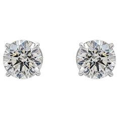 A classic pair of stud earrings showcasing two round brilliant diamonds, each weighing 3.06 carats and 3.02 carats, J-K in Color and SI1-VS2 in Clarity. Set in a simple four prong basket setting, Finely made in 18K White Gold. Roman Malakov is a custom house, specializing in creating anything you can imagine. If you would like to receive a special quote on a custom piece please message or call us. Round Diamond Earrings, Expensive Jewelry Luxury, Basket Setting, Custom House, Special Quotes, Expensive Jewelry, Diamond Stud Earrings, Diamond Stud, Brilliant Diamond