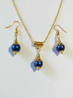 Cobalt blue pearl gold jewelry set Royal blue pearl gold tone jewelry set bohemian set wedding jewelry Victorian jewelry set Boho set Bohemian Cobalt blue glass pearl and gold-tone Victorian filigree jewelry set earrings and necklace . Gold-tone beautiful Boho jewelry set earrings and necklace . Bohemian jewelry set . Victorian style gold tone and fine Royal blue glass pearl dangle earrings and necklace . Chic gold toned pearls jewelry set . Romantic blue pearls jewelry set . Brides or bridesmaids jewelry set . Absolutely beautiful jewelry set ! FREE SHIPPING  Material : blue glass pearls, gold tone metal ornaments beads, steel , gold-tone metal chain. Length of earrings with hooks : 1.80 inches ( 4.5 cm) Length of chain necklace - 18.20 inches (46 cm.) If you have any question, please con Bohemian Pearl Charm Party Jewelry, Blue Pearl Pendant Jewelry, Blue Pearl Drop Jewelry For Gift, Blue Pendant Jewelry With Pearl, Blue Jewelry With Pearl Charm And Round Beads, Blue Pearl Jewelry For Jewelry Making, Blue Pearl Drop Jewelry, Blue Gold-plated Jewelry For Party, Blue Gold Plated Jewelry For Party