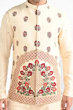 Rajasthani floral Hand embroidered nehru kurta set made in cream bamberg raw silk. Paired with cream slim fit Pant Pajama. Color of the actual garment may vary due to lighting conditions during the shoot.

Size Chart For Men





	
	
					Men's Size Chart
		

		
		
						
				Size Chart For Men
				Custom Size Measurement Guide
			
			
				
				
				Custom Size Measurement Guide
1. Take your measurements at ease…don’t hold your breath!
2. Be a little generous with the measurements. It’s always e Transitional Off-white Sets With Floral Embroidery, Eid Floral Embroidered Raw Silk Nehru Jacket, Festive Raw Silk Bandhgala With Floral Embroidery, Bollywood Bandhgala With Floral Embroidery For Transitional Season, Diwali Sherwani With Floral Embroidery In Raw Silk, Festive Bandhgala With Floral Embroidery In Raw Silk, Floral Embroidered Bandhgala For Festivals, Bollywood Style Floral Embroidered Sherwani For Eid, Eid Bollywood Sherwani With Floral Embroidery