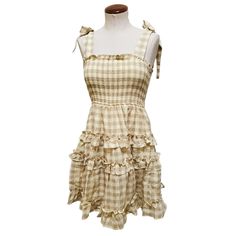 Unique Vintage Storia Light Yellow Gingham Smocked Flare Dress Size: S (Women's 4) Color: Yellow & Tan Retail: $58 Condition: New With Tags! Soak Up The Sun, Ladies! This Adorable Dress Is Crafted In Cotton That Dances With A Light Yellow And Nude Gingham Throughout. The Smocked Bodice Is Accented With A Sweet Ruffle Around The Straight Neckline And Secured With Self Tie Straps. The Gathered Flare Skirt Drops From The Seamed Waist And Boasts Ruffled Tiers That Dance High Above The Knees! Barbiecore, Country Chic, Girlie-Girl Vibes Material: 100% Cotton Measures: 27" Bust, 25" Waist, 35" Length From Shoulder, 20" Skirt Length Vintage Summer Mini Dress With Ruffle Hem, Yellow Retro Dress With Ruffles, Gingham Mini Dress With Ruffles, Gingham V-neck Dress With Ruffles, Vintage Yellow Ruffled Top, Unique Vintage Dresses, Yellow Gingham, Girlie Girl, Soak Up The Sun