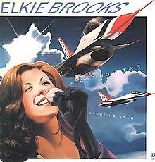 an album cover with a woman singing into a microphone and two airplanes flying in the sky