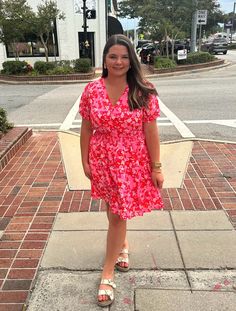 Get ready to blossom in our Pink Floral V Neck Dress! With its fun and flirty ruffle tiered design, this dress will make you stand out from the crowd. Perfect for any occasion, it's a must-have addition to your wardrobe. Embrace your playful side in this unique and stylish dress. Cute Flowy Ruffle Dress For Summer, Casual Tiered Mini Dress For Garden Party, Spring Pink V-neck Tiered Dress, Cute Spring Tiered Dress, Cute Tiered Dress With Ruffle Hem, Flirty Pink Tiered Mini Dress, Flirty Pink Tiered Dress, Summer Tiered Dress With Ruffled Skirt For Day Out, Pink V-neck Tiered Summer Dress