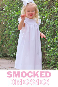 Step into style in our Shine Like A Pearl White Smocked Dress. Versatile for any occasion, this dress features geometric smocking adorned with pearls and adorable flutter sleeves with white picot trim. Elegant Smocked Dress With Flutter Sleeves For Summer, Fitted Smocked Dress With Flutter Sleeves For Daywear, Ruffle Sleeve Dress With Smocked Back For Daywear, Fitted Smocked Dress With Ruffle Sleeves, Summer Dresses With Smocked Cuffs And Ruffle Sleeves, Daywear Smocked Dress With Flutter Sleeves And Ruffles, Daywear Smocked Dress With Ruffle Sleeves, Summer Daywear Smocked Dress With Smocked Cuffs, Summer Smocked Dress With Flutter Sleeves For Daywear