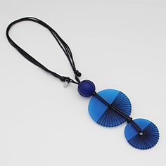 "Add flare to your outfit with this frosted lightweight resin pendant. Two blue round resin beads intricately wrapped in black thread are stacked together and hung from an adjustable black wax cord. Wear alone or with the coordinating earrings; the options are endless! Adjustable Length: 24\"-32\" Pendant: 6\" L x 2\" W Made to match: LS23E13 BLUE  Care Instructions: Remove jewelry when applying perfumes, creams, washing hands, etc. Do not store in direct sunlight. To restore color and shine, ap Turquoise Statement Earrings, White Statement Earrings, Blue Statement Necklace, Washing Hands, Abstract Earrings, Chunky Earrings, Brown Necklace, Wrapped Necklace, Wrap Necklaces