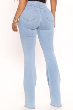 Our sexiest flare jean is offered in a range of washes in a high stretch, super soft fabric that hugs every curve. Fitted in the hips and thighs while flaring at the knee, these jeans elongate the legs and are perfect with a heel. Now offered in a range of washes, colors, and inseams. Available In Multiple Washes Petite 31" Inseam, Regular 34" Inseam, & Tall 37" Inseam High Stretch Denim 11.5" High Rise 22" Flare Leg Opening Faux Front Pockets Functional Back Pockets Disclaimer: Due To The Speci Tomboy Outfits, Denim Flares, Dark Denim, Medium Blue, Jeans Style, Flare Jeans, Bell Bottom Jeans, Stretch Denim, Fit And Flare