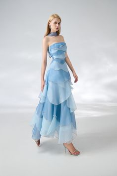 The dress is expertly designed with a classic straight neck and layered organza material, creating an elegant ankle-length silhouette. Perfect for formal occasions, this dress exudes sophistication and timeless style. *Product length is measured from the shoulder to the hem. Light Blue Party Dress, Organza Material, Fashion Reference, Happy Clothes, Gaun Fashion, Mean Blvd, Ankle Length Dress, Layered Fashion, Fairytale Dress