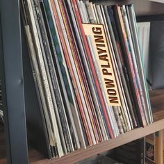 a book shelf filled with lots of records