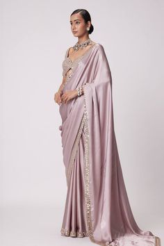 Ash pink saree crafted in satin with prism sheesha embroidery on the border. Paired with a half sleeves sweetheart neck blouse with mirror-vine embroidery. - Aza Fashions Sheesha Embroidery, Pink Satin Saree, Saree Satin, Mirror Blouse, Vani Vats, Vine Embroidery, Saree Gowns, Ash Pink, Dhoti Saree