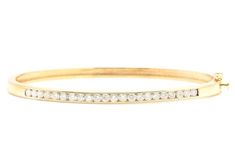 Very Impressive 1.40 Carats Natural Diamond 14K Solid Yellow Gold Bangle Bracelet  Suggested Replacement Value: Approx. $6,000.00 STAMPED: 14K Total Natural Round Diamonds Weight: Approx. 1.40 Carats (color G-H / Clarity SI) Bangle Wrist Size is:  7 inches Width: 2.42mm Bracelet total weight: Approx. 12.3g Disclaimer: all weights, measurements and colors are approximate and may vary slightly from the listed dimensions or as seen in the image. All pictures are magnified to show the smallest of de Yellow Gold Channel Set Diamond Bracelet, Formal Yellow Gold Tennis Bracelet Channel Set, Formal Yellow Gold Channel Set Tennis Bracelet, Classic Yellow Gold Bracelet With Channel Set, Classic Yellow Gold Diamond Bracelet With Channel Set, Classic Yellow Gold Diamond Bracelet Channel Set, Classic Yellow Gold Channel Set Diamond Bracelet, Classic Yellow Gold Bracelet Channel Set, Classic Yellow Gold Bracelets Channel Set