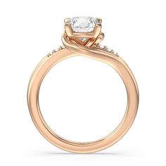 a rose gold engagement ring with an oval cut diamond in the center