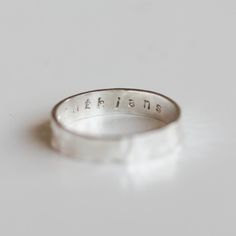 Personalized ring made of sterling silver with shining finish surface. For the inside you may choose any inscription you like: your beloved initials, a special date or an inspirational word. Each letter on the ring is hand stamped and gives a fetching feel of a handmade piece. Though it may cause some imperfections (which are a part of the unique, custom made piece), you can be sure that there are no identical inscriptions. You may choose the width of the band to be 2mm, 3mm or 4mm. You may orde Faceted Ring, Personalized Ring, Textured Ring, Initial Ring, Aquamarine Stone, Personalized Rings, March Birth Stone, Slovakia, Stackable Rings