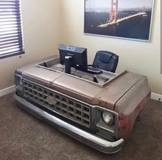 an old truck desk with a laptop on it