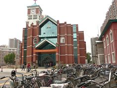 many bicycles are parked in front of a church