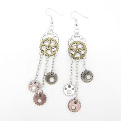 CosplayThese fabulous Jewelry Vintage Gears Earrings Steampunk will dazzle and add style to your ensemble. They are full of personality and make the perfect statement piece for any occasion. Whether you purchase them for yourself, as a gift, or for your special someone, these exquisite earrings will be sure to please. The steampunk design is stylish, industrial and vintage and will make a unique addition to your look. A perfect mix of Goth and Victorian, these trendy earrings will make a great g Handmade Punk Metal Jewelry, Metal Drop Earrings For Party, Handmade Alloy Earrings For Party, Fantasy Metal Earrings With Ear Wire, Metal Drop Cartilage Earrings For Party, Gold Punk Dangle Jewelry, Gold Dangle Punk Jewelry, Handmade Alloy Drop Earrings, Handmade Fantasy Metal Cartilage Earrings