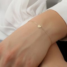 Solid Gold Heart Bracelet, Delicate Bracelet, Dainty Bracelet, Small Heart Bracelet 14k Rose, White, Yellow Gold, Gift for Her Lilliana Solid Gold Handmade The dimension of the Heart: 5.5x7.5mm Available 14K White, Yellow, Rose Gold ( SOLID GOLD ) Please note. The adjustable option is available upon request. Please see the Personalization box under the drop-down menu. Orders with free shipping go out with USPS First Class Mail tracking. We require a signature for orders more than $500. If you ne Elegant Delicate Chain Bracelet For Valentine's Day, Elegant Heart Bracelet For Valentine's Day With Delicate Chain, Adjustable Delicate Heart Bracelet, Elegant Valentine's Day Heart Bracelet With Delicate Chain, Delicate Bracelets For Valentine's Day, Delicate Yellow Gold Heart Bracelet, Delicate Heart Bracelet With Delicate Chain, Elegant 14k Gold Bracelets For Valentine's Day, Delicate 14k Gold Bracelets For Valentine's Day