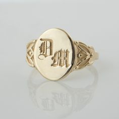 This vintage-style signet ring is inspired by our classic botanical style, and features leaf-like flourishes on each size, framing a simple center that displays your personal monogram or initials. CUSTOMIZATION AND FONTS * Usually Gothic letters are preferred for this ring, but I can place any type of design or font. * This ring can be customized with any letter or word (provided it fits) and is made in solid gold. This ring can be made for men or women and in your preferred size or color of gol Formal Oval Monogram Initial Ring, Classic Oval Signet Ring With Initials, Classic Monogram Signet Ring For Formal Occasions, Classic Formal Monogram Signet Ring, Classic Oval Ring With Initials, Classic Oval Signet Ring Personalized, Classic Personalized Oval Signet Ring, Classic 14k Gold Signet Ring With Initials, Classic Oval Ring With Engraving Option