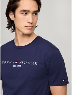 Tommy Hilfiger men's T-shirt. Made from lightweight cotton jersey, known for its breathability and stretch, our comfortable crewneck tee is cut in an easy fit and finished with our embroidered Tommy Logo.  Material: 100% Cotton. Classic Tommy Hilfiger T-shirt For Summer, Classic Tommy Hilfiger Summer T-shirt, Casual Tommy Hilfiger Tops With Embroidered Logo, Essential Crew Neck T-shirt With Letter Print, Cotton T-shirt With Logo Print, Tommy Hilfiger Cotton T-shirt With Text Print, Tommy Hilfiger Logo Print Crew Neck T-shirt, Tommy Hilfiger Crew Neck T-shirt With Logo, Tommy Hilfiger Text Print Cotton T-shirt