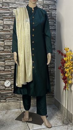 This stylish sherwani suit is made  of high quality silk fabric. Its a two piece dress. This is stitch in front open sherwani style kurta emblished with silver buttons having sequin work Custom to order. All sizes available Stitching  For stitched dresses you can chose from size chart or can message us for customization.our team will send you size chart for customization. Feel free to convo for any details to help you in your selection because customize dresses cannot be return or exchange. Note: color may slightly vary because of different screen resolutions. We have an expert customization team .if you have any problem regarding taking measurements please convo for our help. All the measurements are rechecked before dispatch. Elegant Semi-stitched Silk Sherwani, Silk Sherwani With Dabka Work, Elegant Sherwani With Sheer Dupatta For Diwali, Elegant Raw Silk Sherwani Straight Kurta, Unstitched Dola Silk Sherwani With Dupatta, Elegant Sherwani In Raw Silk With Straight Kurta, Designer Dola Silk Sherwani With Dupatta, Unstitched Sherwani With Dupatta In Dola Silk, Elegant Cotton Silk Sherwani For Festive Season