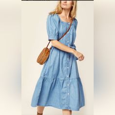 A Flirty, Flouncy Denim Dress With Sweet Puff Sleeves. Wear It Long And Loose Or Use The Removable Tie To Cinch At Your Waist, It's A Flattering Fit Either Way. A Flirty And Flouncy Denim Dress Puff Sleeves Removable Waist Tie Style # A09030000 Color: Hey Friend - Light Wash How It Fits Relaxed Fit Composition & Care 82% Cotton, 18% Tencel Lyocell Denim Tencel Is A Trademark Of Lenzing Ag Imported Cotton Denim Midi Dress With Buttons, Washed Blue Cotton Dress With Button Closure, Levi's Spring Dresses For Day Out, Levi's Dresses For Spring Day Out, Levi's Casual Dresses For Spring, Levi's Casual Spring Dresses, Denim Blue Denim Dress With Buttons For Daywear, Casual Levi's Dresses For Spring, Denim Dress With Buttons For Daywear