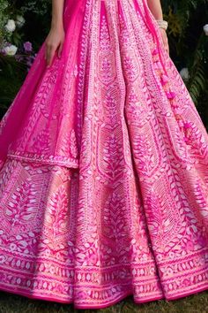 Fuchsia raw silk lehenga featuring intricate gota and thread embroidery. Paired with a padded blouse, dupatta, and a belt., Fit: Relaxed Pink Lehenga With Motifs For Navratri, Pink Traditional Wear With Motifs For Wedding, Pink Traditional Wedding Wear With Motifs, Pink Saree Dress With Motifs, Pink Saree With Motifs, Bollywood Pink Sharara With Motifs, Pink Wedding Choli With Motifs, Pink Fitted Dress With Motifs, Designer Pink Lehenga With Motifs