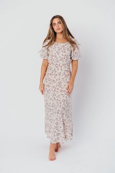 Discover effortless elegance in our charming Lucia Maxi Dress - it's already a favorite here at Worth Collective! This beautiful dress is cut on the bias, ensuring an ultra-flattering and feminine fit. The Lucia's puffed sleeves and flowy skirt only add to its vintage allure, and its gorgeous lilac floral print is spring-ready! Pair with pumps or dainty sandals for an extra-special event. FIT: Runs true to size. Fabric does not stretch; bias cut makes this dress more fitted through the waist and Fitted Floral Print Maxi Dress With Puff Sleeves, Modest Floral Print Dress With Puff Sleeves, Spring Fitted Maxi Dress With Puff Sleeves, Fitted Maxi Dress With Puff Sleeves For Brunch, Fitted Puff Sleeve Maxi Dress For Casual Occasions, Fitted Maxi Dress With Puff Sleeves For Casual Occasions, Modest Ruched Dress For Garden Party, Short Sleeve Maxi Dress With Fitted Bodice For Brunch, Feminine Fitted Maxi Dress With Short Sleeves