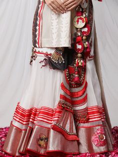 Garad Angrakha Lehenga - Inspired by gauri(durga), this lehanga set brings elements of akalbodhan, translating to the untimely awakening of Durga. The set features a gota bralette, an angrakha jacket and a full-pleated skirt, making it a perfect royal garment for your special occasions. Bohemian Pre-draped Saree For Festivals And Ceremonies, Bohemian Wedding Pre-draped Chanderi Saree, Bohemian Sheer Dupatta Sets For Festive Season, Bohemian Sets With Sheer Dupatta For Festive Season, Bohemian Festive Sets With Sheer Dupatta, Bollywood Style Pre-draped Saree With Tilla For Navratri, Festive Bohemian Sets With Sheer Dupatta, Bohemian Choli With Sheer Dupatta For Festive Season, Festive Bohemian Pre-draped Saree With Cutdana