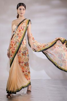 Multicolor floral print and sequin panel half half pre draped saree. Comes with padded tube blouse.
Components: 2
Pattern: Printed
Type Of Work: Floral
Neckline: Sweetheart
Sleeve Type: Sleeveless
Fabric: Georgette, Sequin georgette
Color: Multi Color
Other Details: 
Blouse front buckle detail
Length:
Blouse: 14.5 inches 
Saree :43  inches 
Model Height: 5ft 8inches wearing size S
Closure: Saree: Side zip
Occasion: Sangeet,Mehendi and Haldi - Aza Fashions Fitted Pre-draped Saree With Floral Print For Festive Occasions, Fitted Floral Print Pre-draped Saree For Navratri, Georgette Pre-draped Saree With Floral Print, Floral Print Pre-draped Saree For Reception, Navratri Silk Pre-draped Saree With Floral Print, Fitted Dupatta With Digital Print For Reception, Multicolor Floral Print Saree For Reception, Diwali Floral Print Pre-draped Saree, Diwali Floral Print Fitted Pre-draped Saree