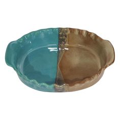 a blue and brown bowl sitting next to each other