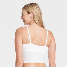 Give your everyday intimates a comfy upgrade with this Cotton Stretch Crop Cami Bralette from Auden™. This crop cami bralette is made of cotton jersey fabric with added spandex for a flexible fit that moves with you, while opaque lining provides extra coverage. The adjustable straps help you find the right fit, and unlined, wireless cups round out the design for support that maintains a natural, comfortable shape. Plus, removable padding provides a customized coverage. Auden™: Comfort true to ev Solid Color Camisole Bra For Loungewear, Seamless Camisole Bra For Loungewear, Seamless Loungewear Bra With Spaghetti Straps, Loungewear Bra With Adjustable Spaghetti Straps, Seamless Spaghetti Strap Bra For Loungewear, Medium Support Camisole With Built-in Bra, Bra Friendly Cami Crop Top For Loungewear, Fitted Cropped Bra For Loungewear, Cropped Fitted Bra For Loungewear